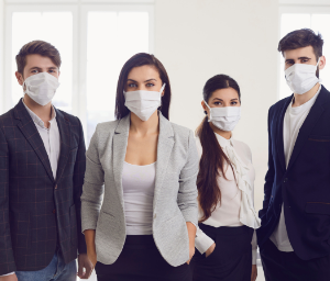 Confident business people with masks on