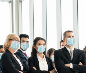 Confident business people with masks on
